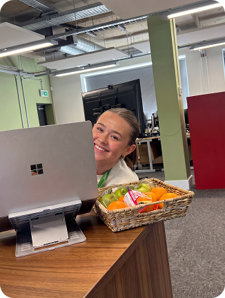 Colleague receiving a hamper at her workstation