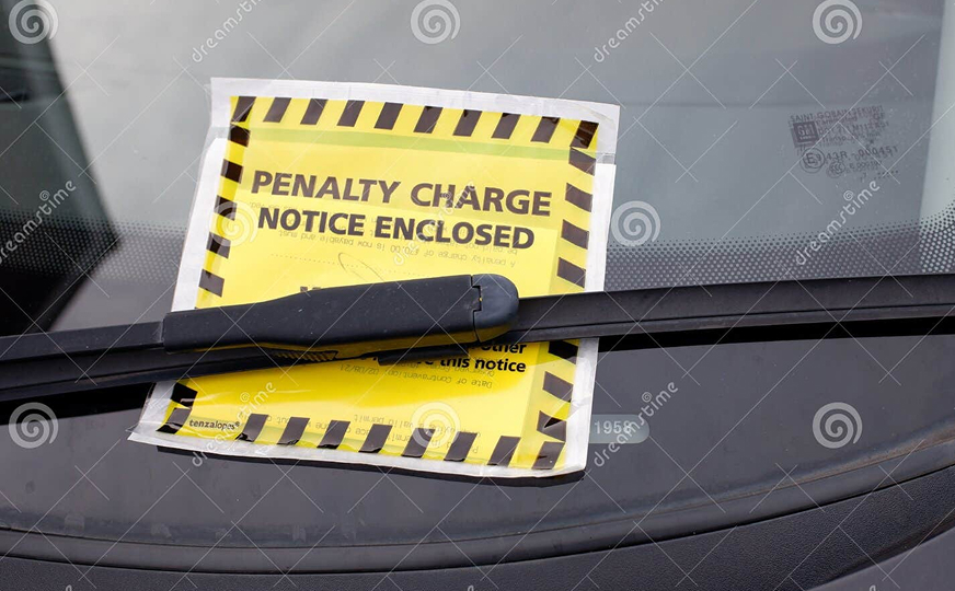Penalty charge notice enclosed on a vehicle windscreen